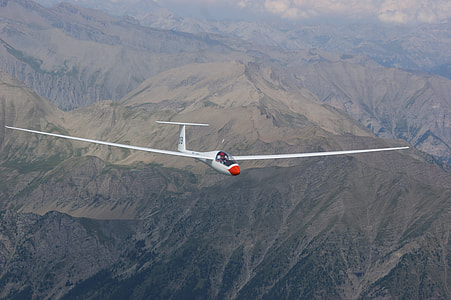 white plane soaring in sky at daytime thumbnail