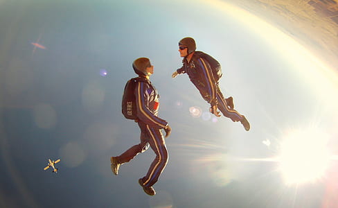 two person facing each other while skydiving thumbnail