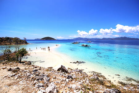 beach shore under blue sky during daytime thumbnail