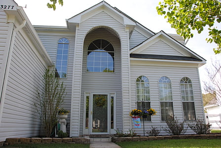 white 2-storey house with green grass thumbnail