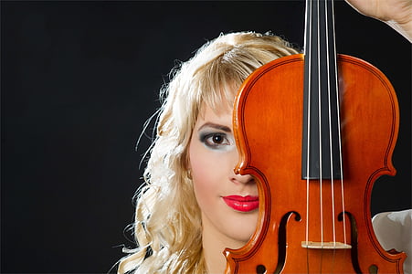 woman covering her face with violin thumbnail