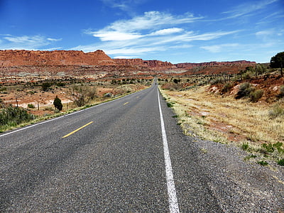 gray concrete road going through the mountains thumbnail