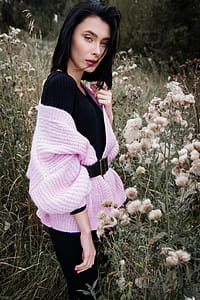 woman wearing black and pink dress on flower field thumbnail