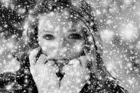 grayscale photo of woman wearing jacket during winter thumbnail