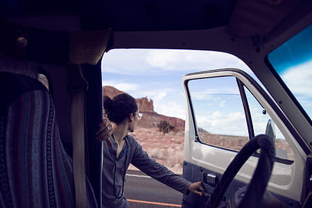 man wearing black long-sleeved shirt near vehicle door thumbnail