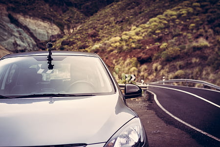 silver car beside road thumbnail