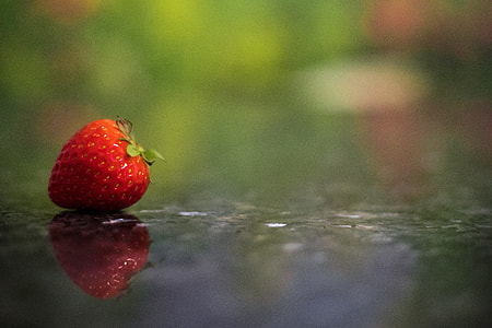 red strawberry on ground thumbnail