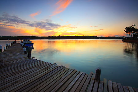 brown wooden dock during sunset thumbnail