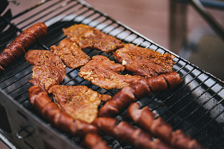 Pork and sausage on the grill thumbnail