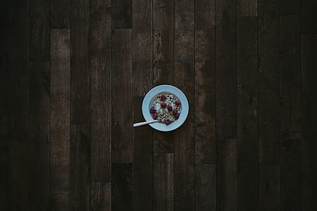 rice with berries in round white ceramic bowl thumbnail