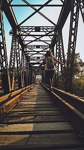 Woman Walking on a Train Rail thumbnail