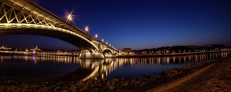 lighted bridge under blue sky thumbnail