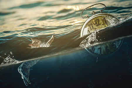 alarm clock floating on body of water thumbnail