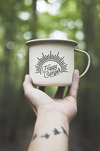 Person Holding White Ceramic Mug thumbnail