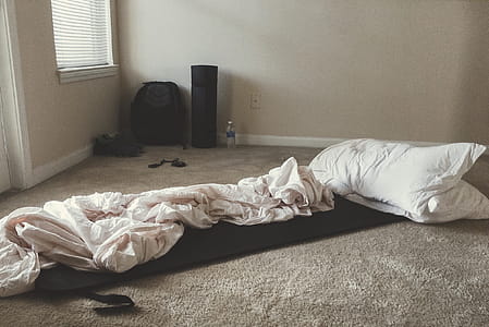 Two White Rectangular Pillows With White Blanket on Floor thumbnail