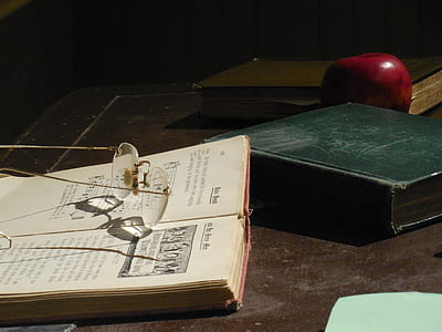 Frameless Eyeglasses on White Book Page thumbnail