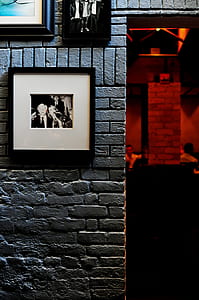 grayscale photo with frame hang neat to door thumbnail