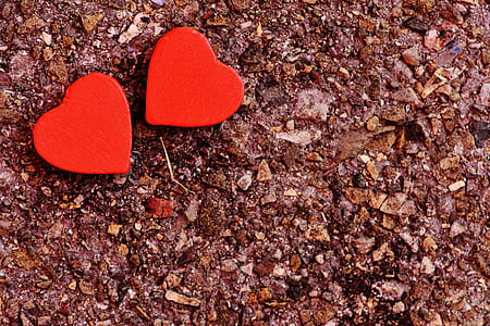 Two Red Heart Decoration on Ground thumbnail