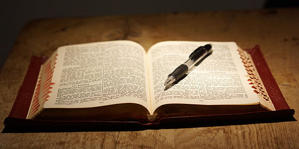 opened bible with click pen thumbnail