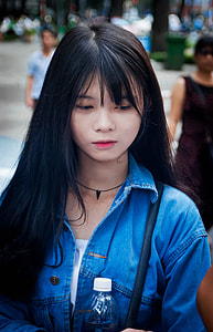 woman wearing blue denim collared shirt thumbnail