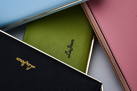 three pink, green, and black Liu Jincn wristlets thumbnail