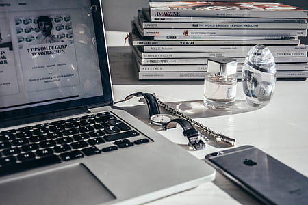 gray and black laptop computer, analog watch, silver iPhone 6s thumbnail