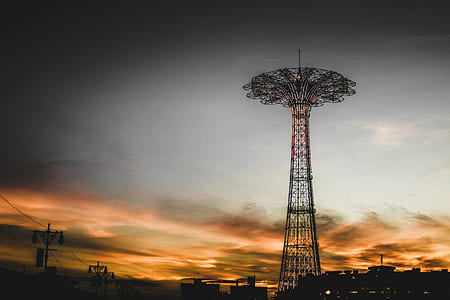 gray metal tower during sunset thumbnail