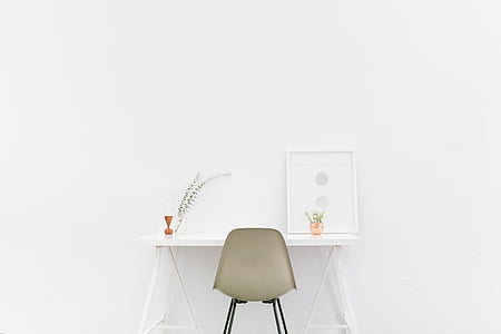 gray armless chair and white wooden side table thumbnail