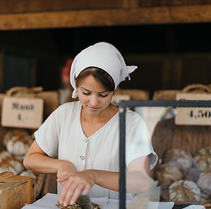 woman holding butcher knife looking down thumbnail