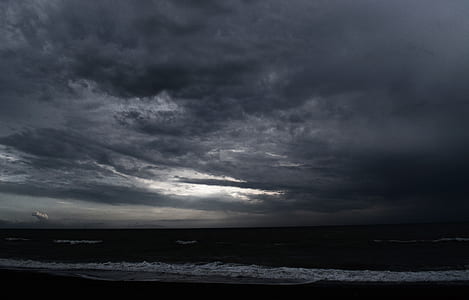 seashore under dark clouds thumbnail