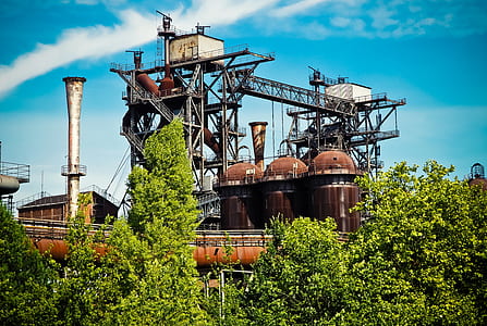 photography of brown and gray factory building at daytime thumbnail