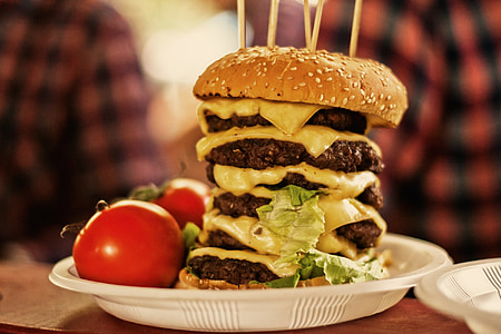 burger patties beside of tomatoes thumbnail