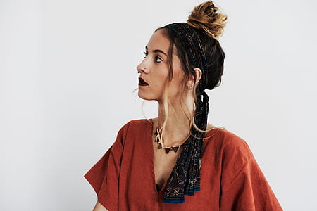 woman in orange V-neck top thumbnail