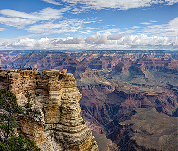 brown and gray canyon formation under white and blue sky at daytime thumbnail