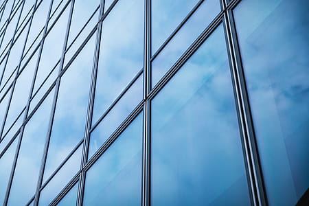 Windows of Skyscraper Business Office with blue sky, Corporate building in city. thumbnail