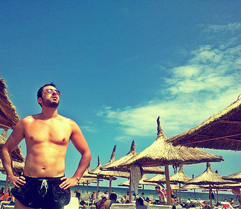 man standing while looking up outdoors thumbnail