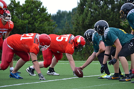 football player on field during daytime thumbnail
