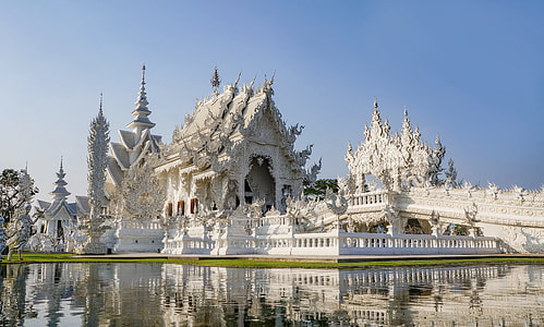 white concrete castle surrounded with water at daytime thumbnail