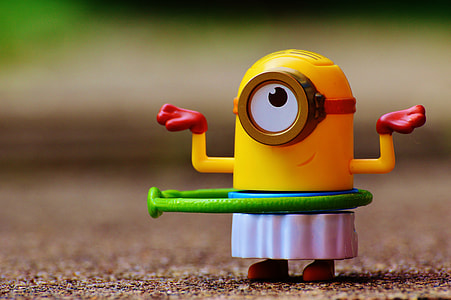 close up photo of Stuart Minion toy using hula-hoop at daytime thumbnail
