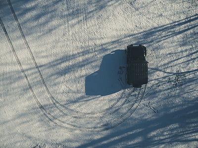 black Jeep Wrangler on snow field thumbnail