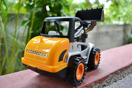 yellow and black excavator plastic toy thumbnail