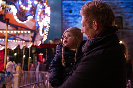 Father And Daughter Watching Lights Photo thumbnail