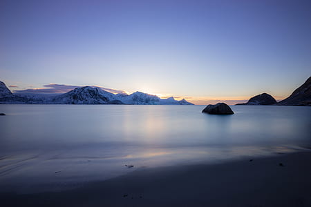 body of water during golden hour thumbnail
