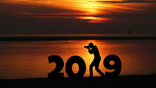 silhouette of man holding camera thumbnail