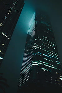 building with lights on during nighttime thumbnail
