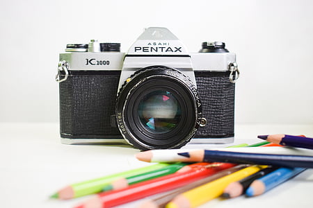 black and gray Pentax SLR camera thumbnail