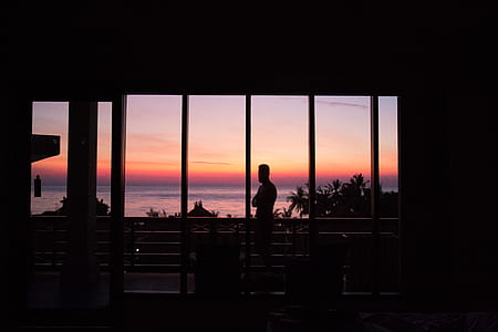 silhouette of person standing on veranda thumbnail