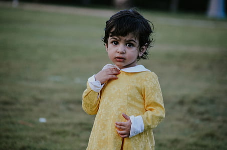 selective focus photograph of girl in yellow dress thumbnail