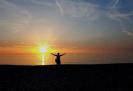 silhouette photography of person arms wide open thumbnail