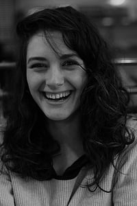grayscale photo of smiling woman thumbnail